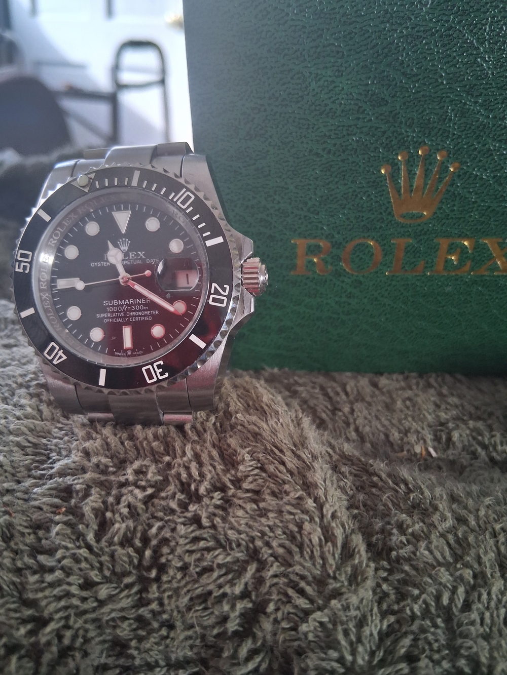 Rolex Stainless Steel Watch with Black Dial and Green Box Accent